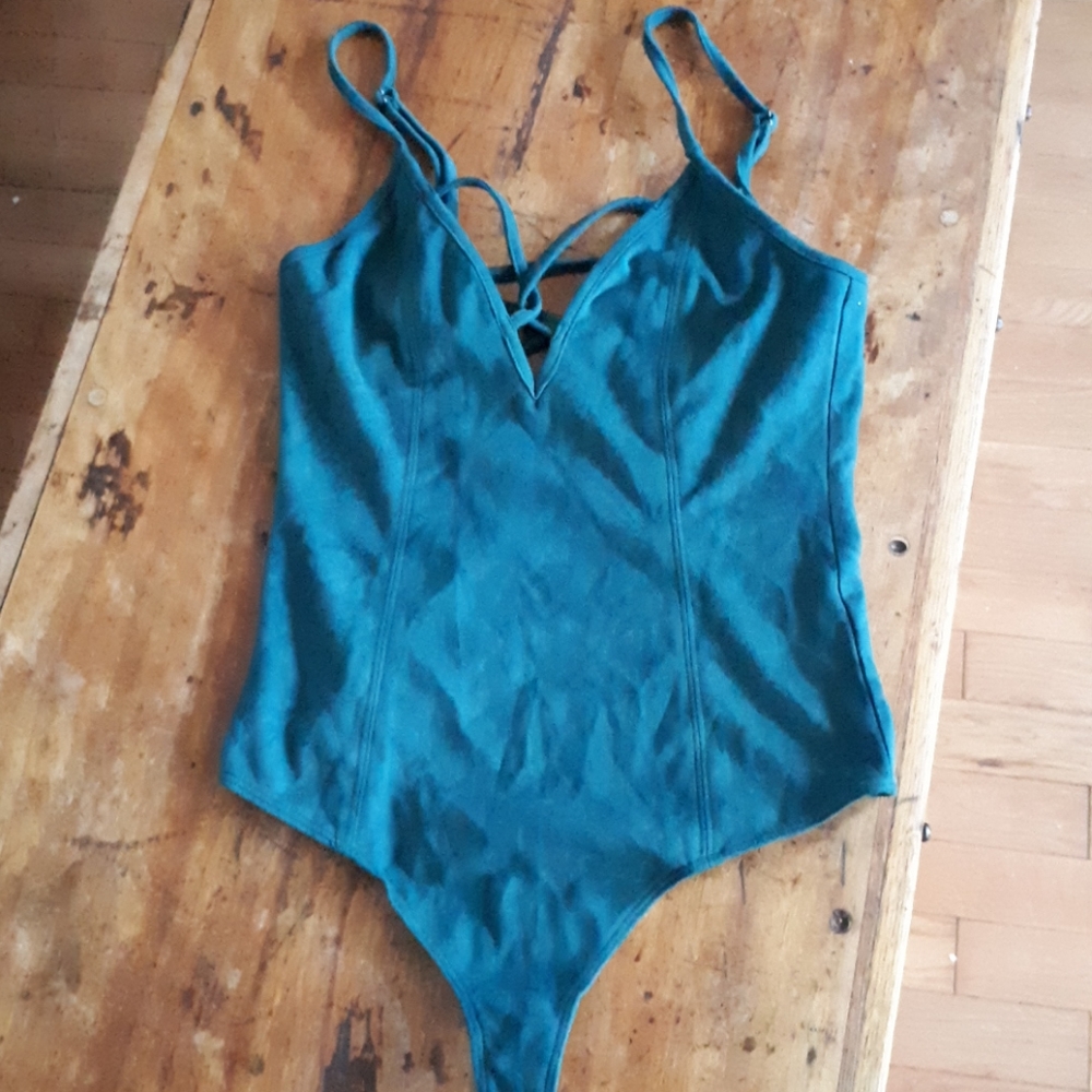 Ultra suede.  Size S bodysuit